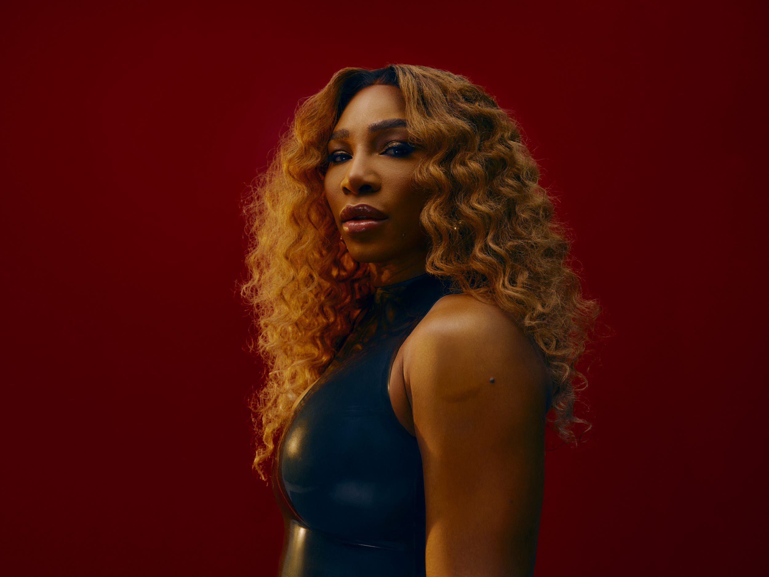 Serena Williams standing in front of a red background for Insider's inaugural cover story