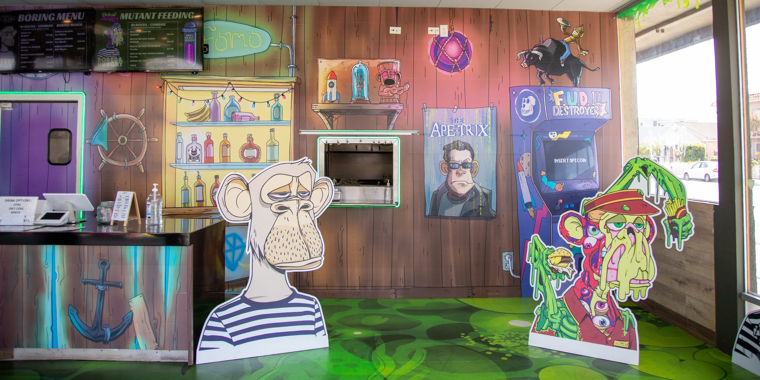 Inside the Bored and Hungry store with ape decals, graphic walls.