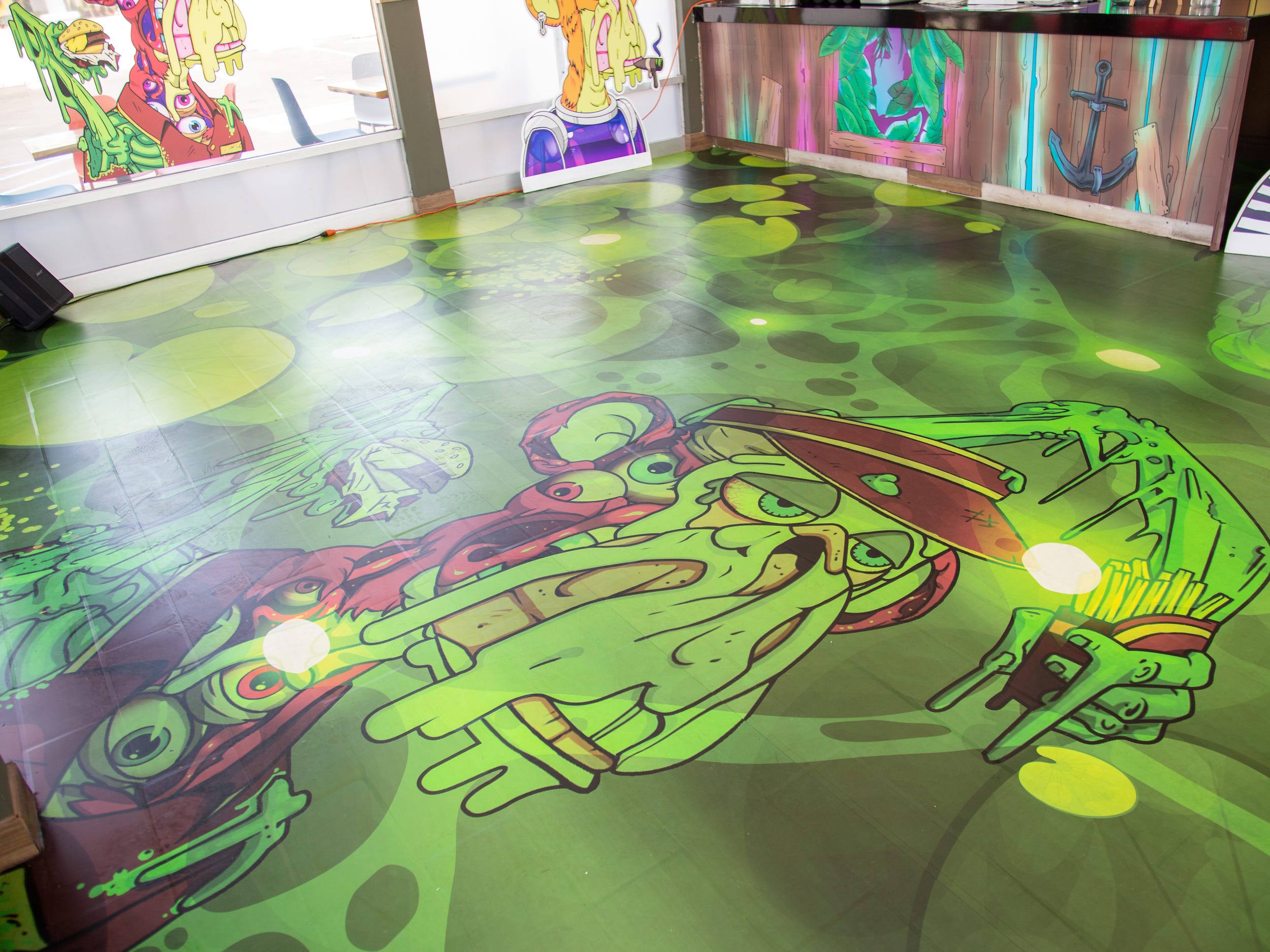 The floor of the store showing a green ape.