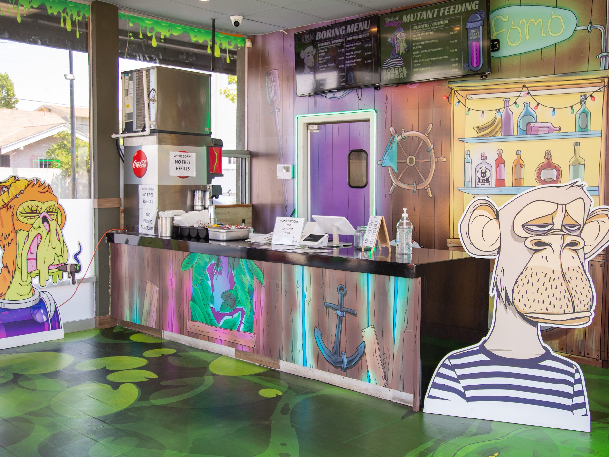 Inside the Bored and Hungry store with ape decals, graphic walls.