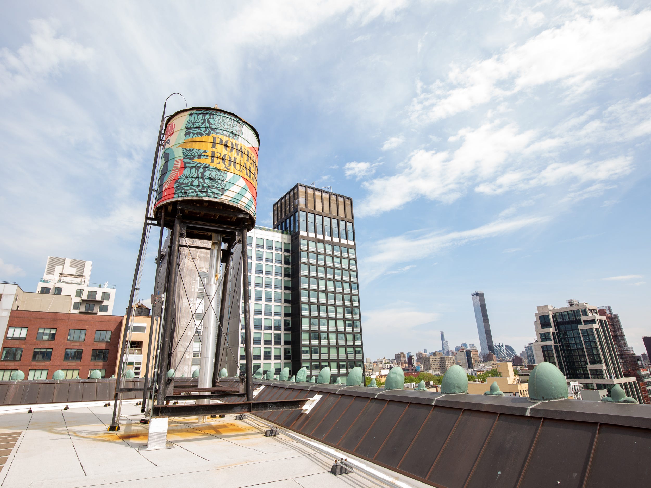 A water tower on a rooftop.