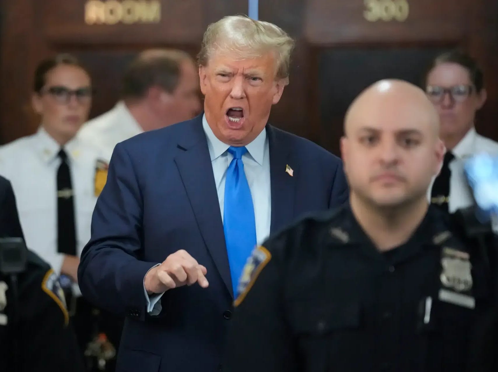 Donald Trump addresses the press just outside the courtroom doors to his Manhattan business fraud trial