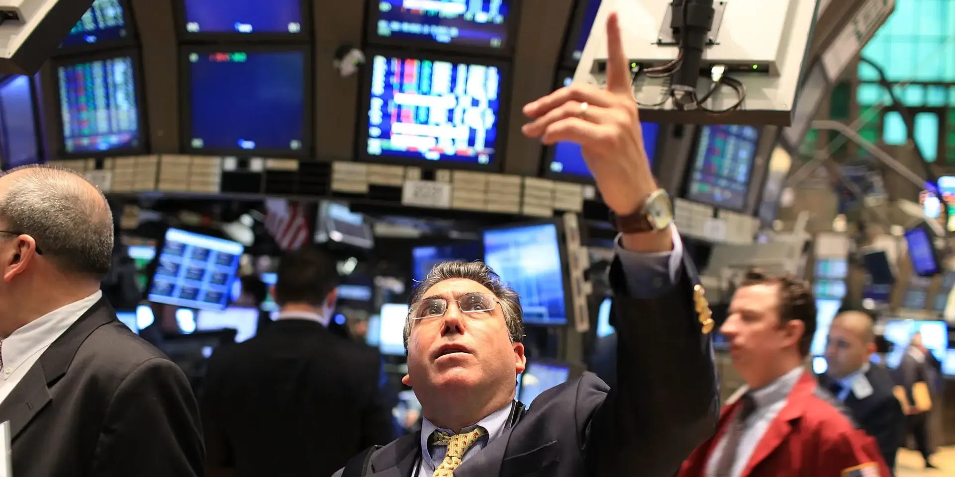 someone on the trading floor, pointing up