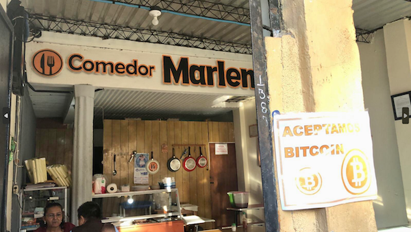 An eatery in El Salvador with a sign displaying it accepts Bitcoin