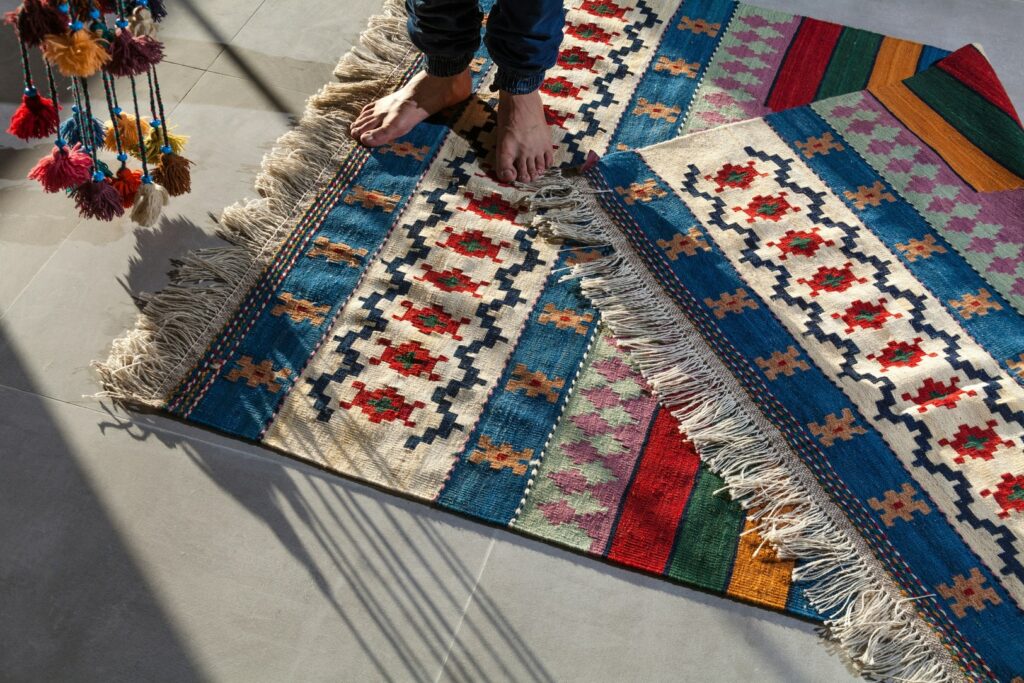 A photo of a person standing on a rug.