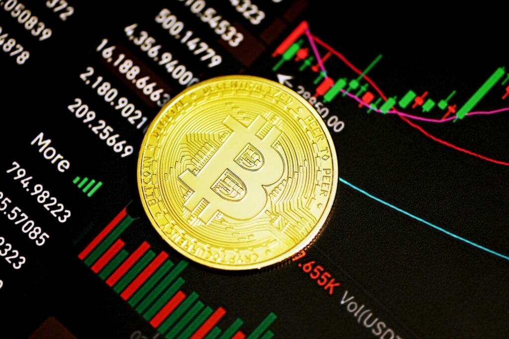 Bitcoin trading with a graph Photo by Kanchanara on Unsplash