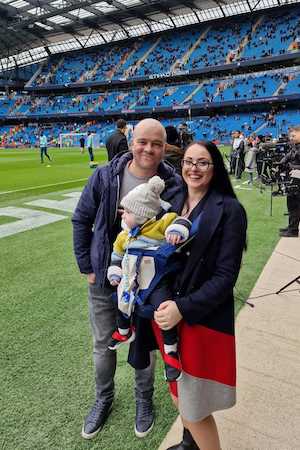 Daniel Anitei, Georgina Anitei and toddler David Anitei at Manchester City Etihad stadium.